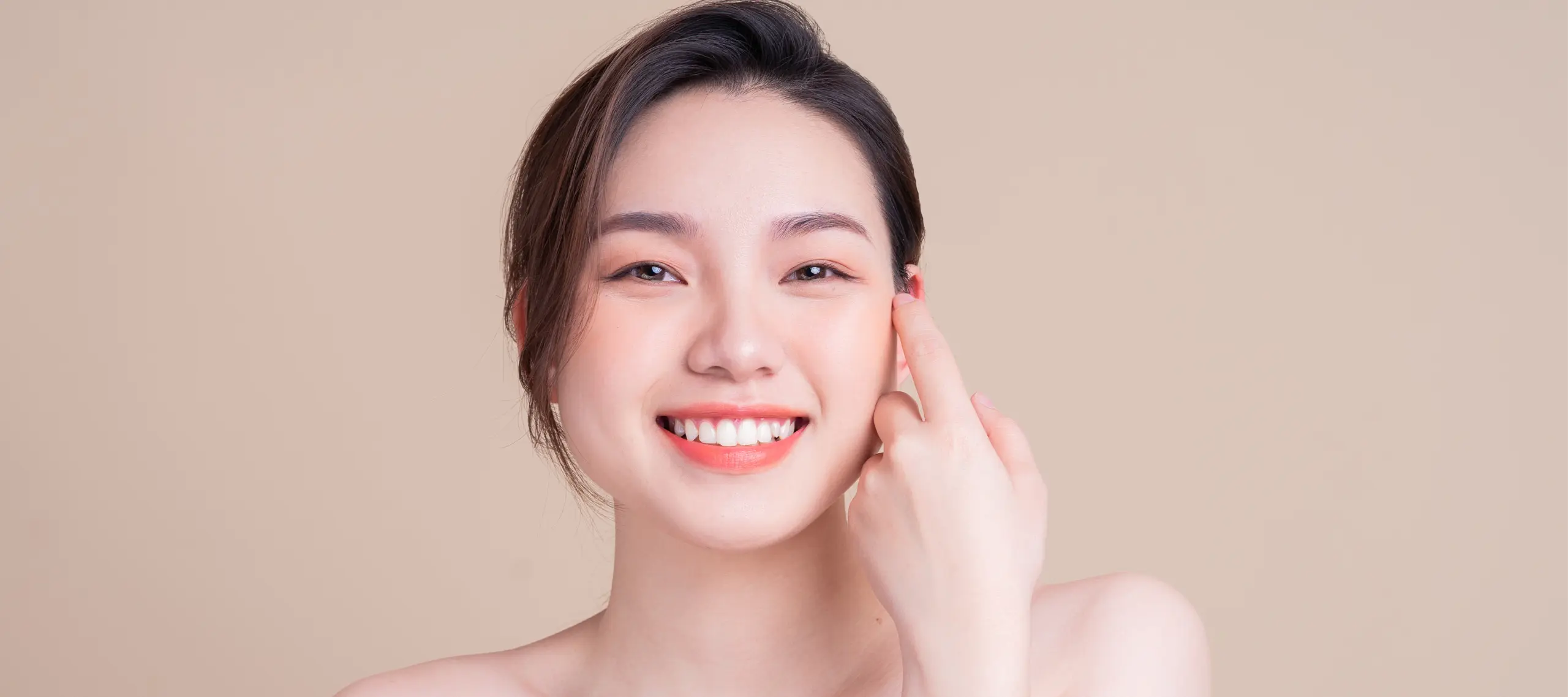 Attractive Young Asian Woman with Fresh Skin. Face Care, Facial Treatment, , Woman Beauty Skin Isolated on White Background. Cosmetology, Beauty Skin and Cosmetic Concept Attractive Young Asian Woman with Fresh Skin. Face Care, Facial Treatment, , Woman Beauty Skin Isolated on White Background. Cosmetology, Beauty Skin and Cosmetic Concept